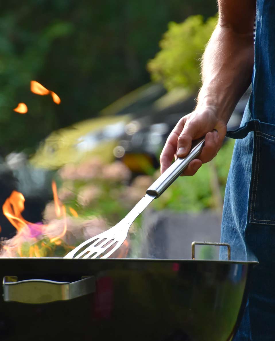 guy cooking on the grill guy cooking on the grill